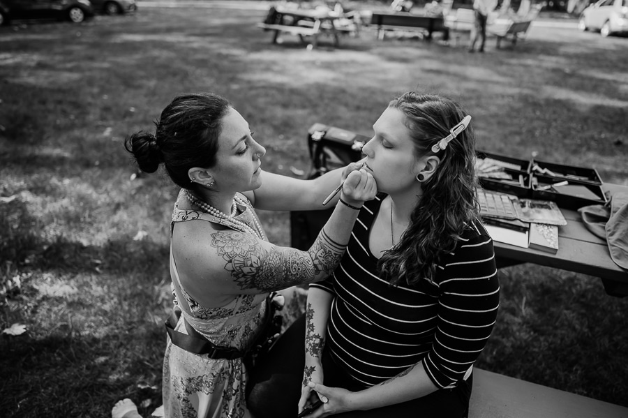 Black and white bride getting makeup done