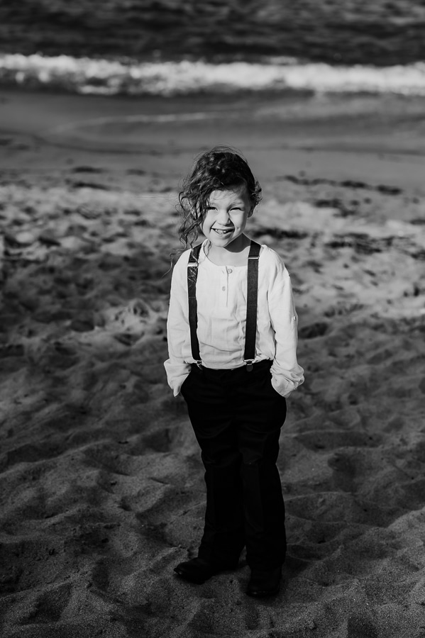 black and white ring bearer on beach