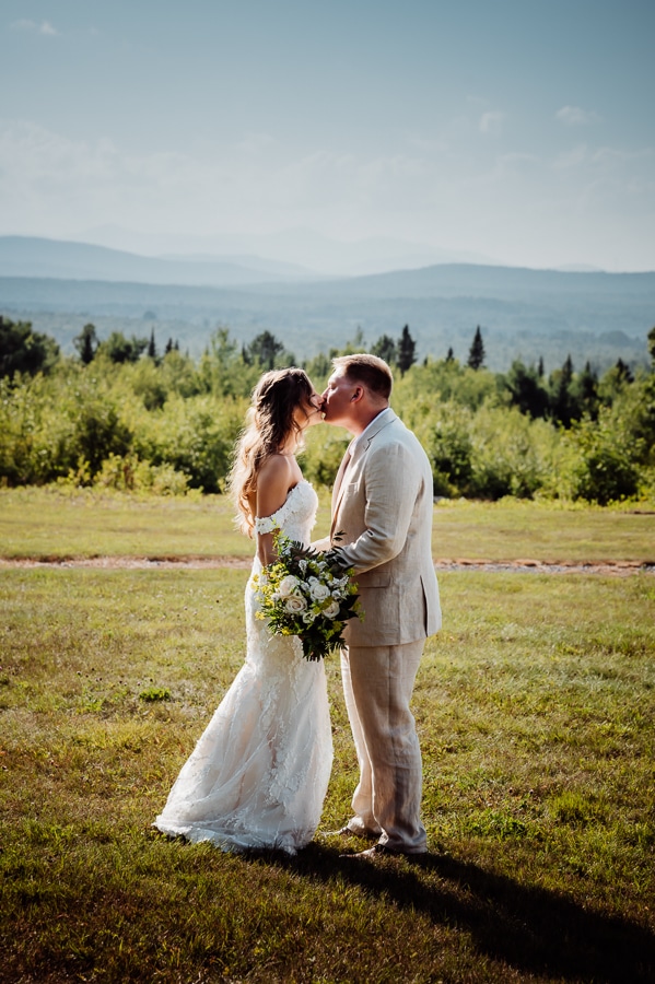 Bride and groom kissing at private vow ceremony on Robbins Hill scenic overlook