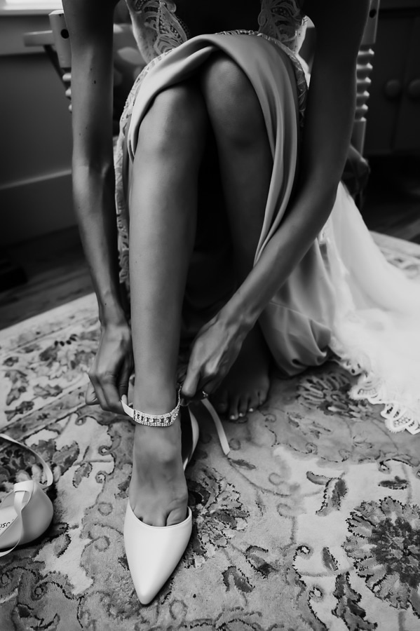 Bride putting on shoe before getting married