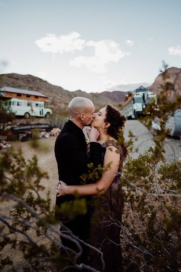 Bride and groom kissing at ghost town in Las Vegas nevada